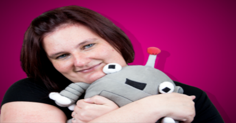 woman holding the mozbot stuffed animal