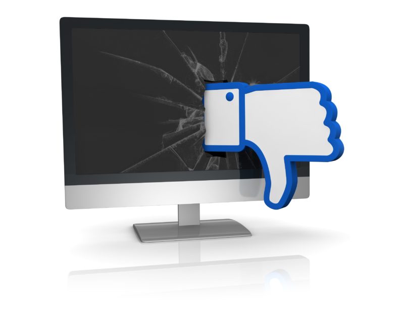 thumbs down icon emerging from a broken computer screen