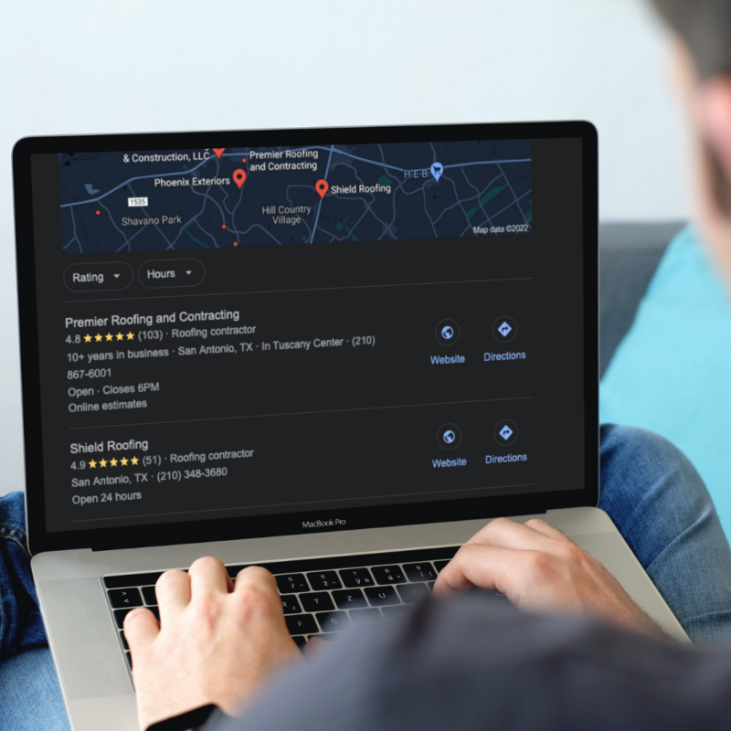 homeowner using their laptop to search for nearby roofing companies on google